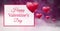 Happy Valentine`s Day text and Shiny bubbly Valentines hearts with purple bokeh misty background