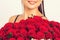 Happy Valentine`s Day. Woman holds luxury bouquet of red roses. Love you
