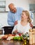 Happy vegetarian couple preparing vegetables