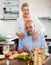 Happy vegetarian couple smiling and cooking vegetables