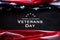 Happy Veterans Day. American flags with the text thank you veterans against a blackboard background. November 11