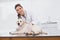 Happy veterinarian examining a cute dog