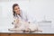 Happy veterinarian examining a cute dog