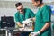 Happy veterinarians examining dog in clinic. Dog at the vet clinic.