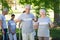 Happy volunteer senior couple smiling at the camera