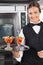 Happy Waitress Holding Dessert Tray