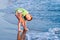 Happy walking child on the sea