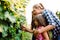 Happy wine grower family walking in vineyard