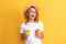 happy winking redhead woman in straw hat hold apple, lunch break