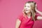 Happy Winsome Caucasian Blond Girl In Coral T-shirt Posing In Summer Shorts While Showing Positive Expression With Hand Lifted