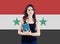 Happy woman against the Syria flag background, new life for syrian refugees concept