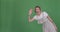 Happy woman appearing greeting hello and disappearing on green screen