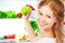 Happy woman with apple and open refrigerator with fruits, vegetables and healthy food