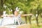 Happy woman with arms wide open enjoying freedom on a convertible automobile roadtrip