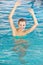 Happy woman bathing in swimming pool