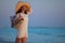 Happy woman on beach at sunset enjoying calming environment