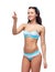 Happy woman in bikini swimsuit pointing finger