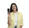 Happy woman with breathalyzer on white background