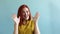 Happy woman with brown hair, happily clapping hand