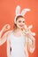 Happy woman in bunny ears with toy. Woman in rabbit bunny ears. Happy easter. Spring holiday. Girl with hare toy. Egg