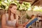 Happy woman in cafe with menu. Beautiful vacation woman in restaurant at dinner.