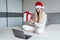 Happy woman celebrating friends with video call. Christmas online holiday celebration, Xmas, new year in lockdown
