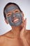 Happy woman, charcoal mask and portrait for beauty, aesthetic dermatology and self care on studio background. Mature