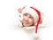 Happy woman with christmas hat peeking through a hole torn in white paper poster