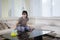 Happy woman cleans a table with a duster brush