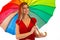 Happy woman with colorful umbrella. Colors of the rainbow. Blond