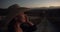 Happy woman, cowgirl and hat at night on farm for sunset, adventure or farming in the countryside. Face of female person