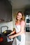 Happy woman cutting eggplant