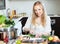 Happy woman cutting seabass