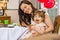 Happy Woman With Daughter Eating Birthday Cake