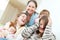 Happy woman with daughters and granddaughters