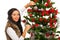 Happy woman decorate Christmas tree