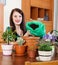 Happy woman doing work in garden at home