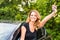 Happy woman driver hold car keys in her new car