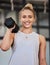 Happy woman, dumbbell and portrait of a athlete with a smile ready for training, exercise and workout. Sports gym