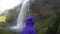 Happy Woman Enjoying Spectacular Waterfall Iceland