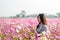 Happy woman farmer owner holding tablet at flower farm for modern farming, technology,smart woman, flower business idea concept