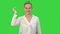 Happy woman finish project and throws scraps of paper on a Green Screen, Chroma Key.