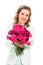 Happy woman giving pink flower