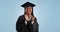 Happy woman, graduation and applause in celebration, winning or success against blue studio background. Portrait of