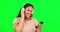 Happy woman, green screen and dance with phone, headphones and hearing radio online. Dancing, female model and listening