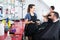Happy woman hairdresser talking to female client