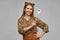 Happy woman in halloween costume of leopard