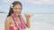 Happy woman on Hawaiian beach - Hawaii vacations