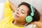 Happy woman with headphones listening to music