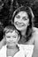 Happy woman and her little son after bathing. Black and white photo.